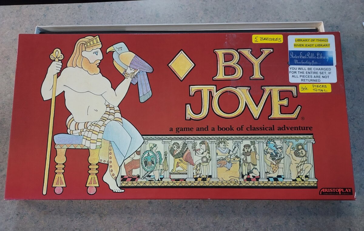 A board game box titled By Jove: a game and a book of classical adventure featuring an illustrated bearded man in a crown holding a scroll, with ancient Greek-style artwork below.