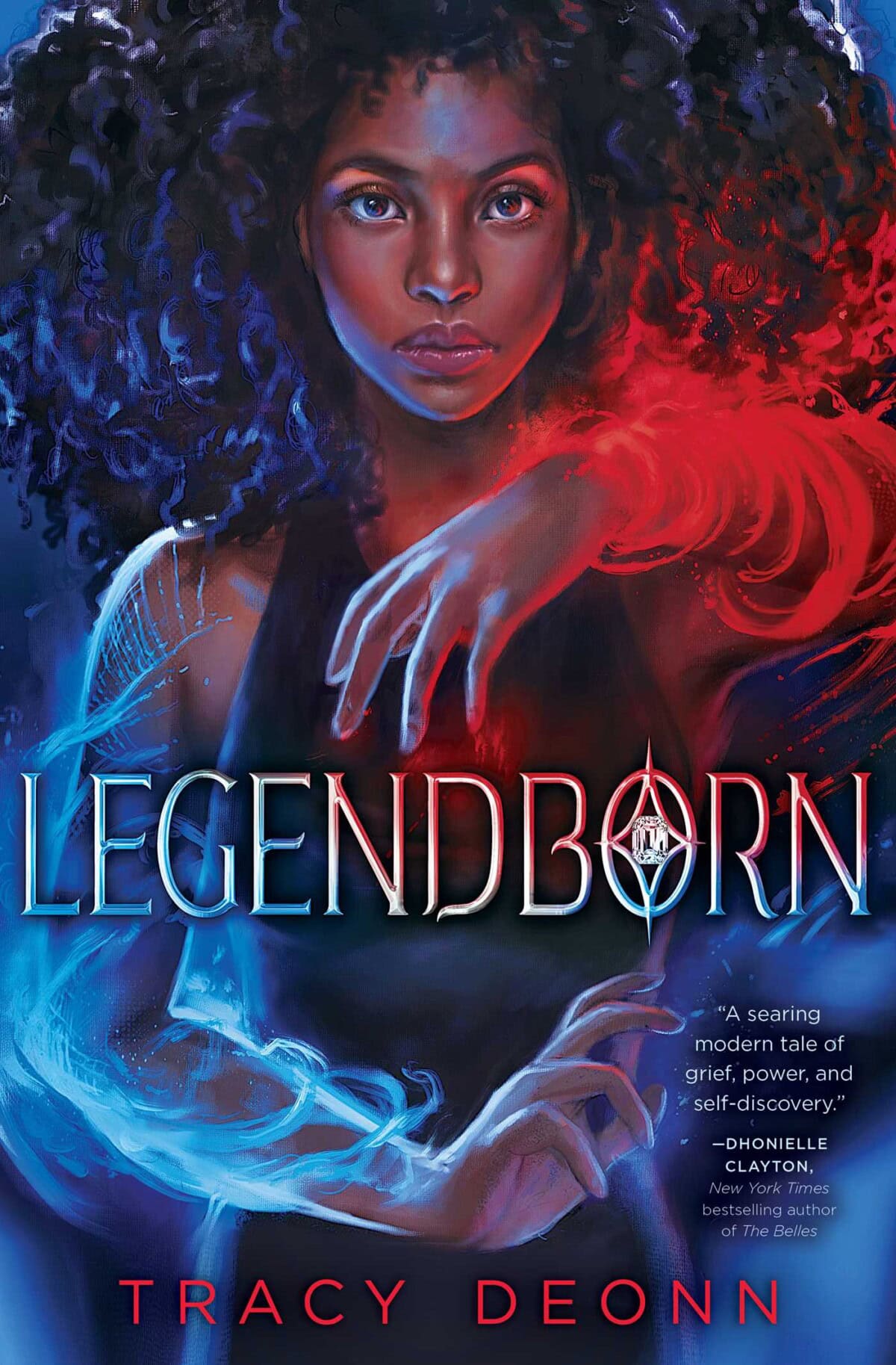 A young Black woman with curly hair stands confidently, her hand glowing with red and blue magical energy. The title Legendborn is overlaid in bold letters, with the author’s name, Tracy Deonn, at the bottom.