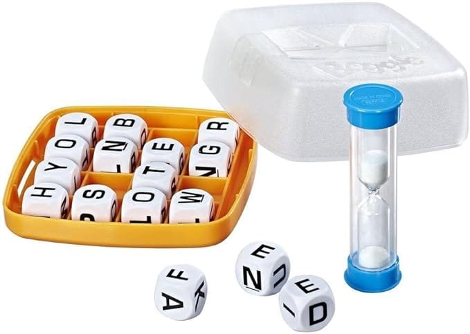 A Boggle word game set with a plastic grid holding letter dice, a clear plastic lid, a blue-and-white sand timer, and three loose dice with letters facing up.