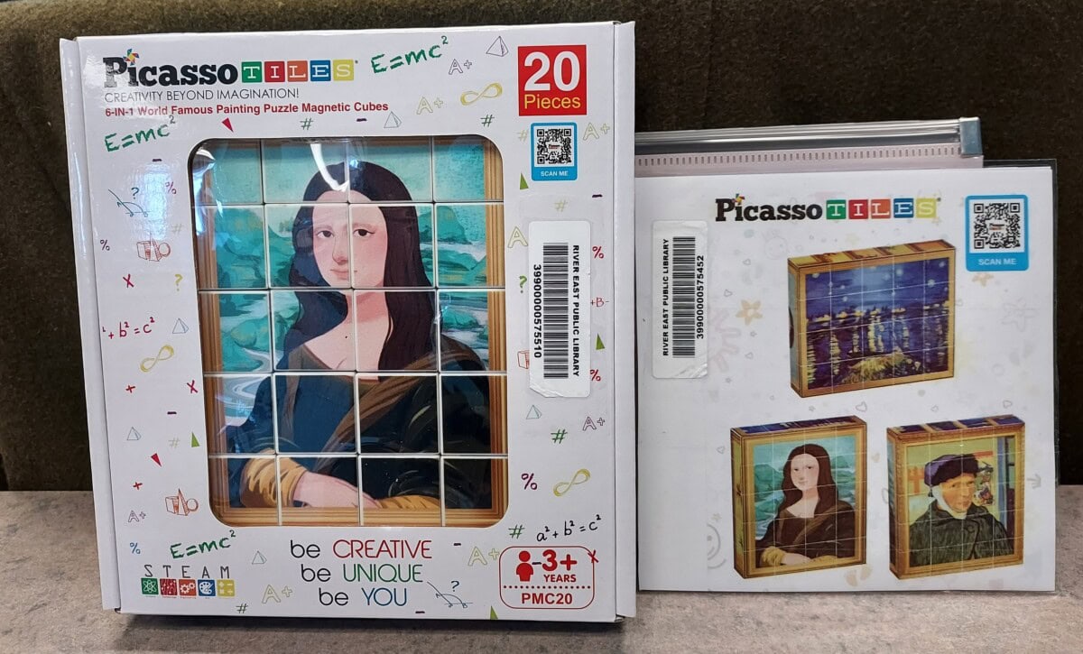 Two PicassoTiles magnetic puzzle sets are shown. One box features a Mona Lisa puzzle with be creative, be unique, be you text and includes 20 pieces. Another package shows magnetic tile puzzles of Mona Lisa and other art on display stands.