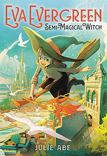 A young witch with a green hat and cloak rides a broomstick over a vibrant town, accompanied by an orange cat-like creature. A castle and birds are in the background. The book title reads Eva Evergreen, Semi-Magical Witch by Julie Abe.